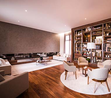 Perspectiva lounge lareira com biblioteca taschen
